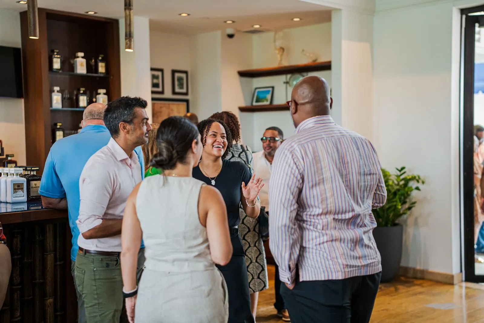Sylena laughing with guests at an event